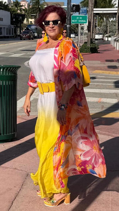Sunset Ombré Set Strapless maxi in a white-to-marigold ombré, light gauze, floor length. Layered with a sheer chiffon duster in coral, tangerine and blush watercolor floral, open front, three-quarter sleeve. Mustard woven belt included.Untitled